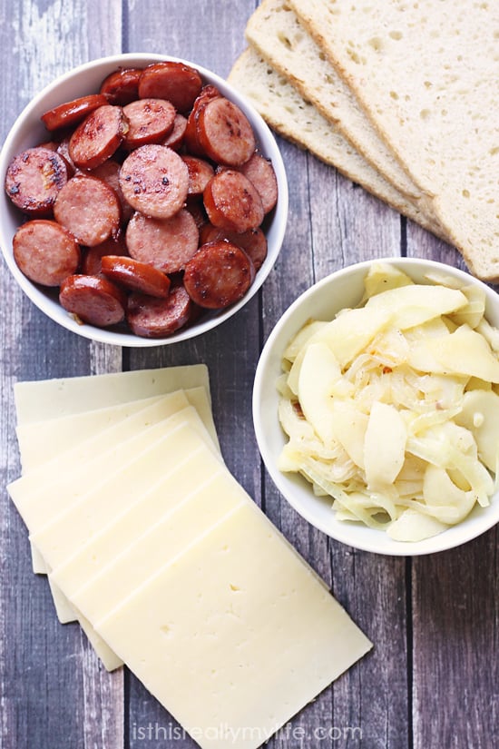 Grilled Sausage Sandwiches with Caramelized Onions and GruyÃ¨re Cheese 