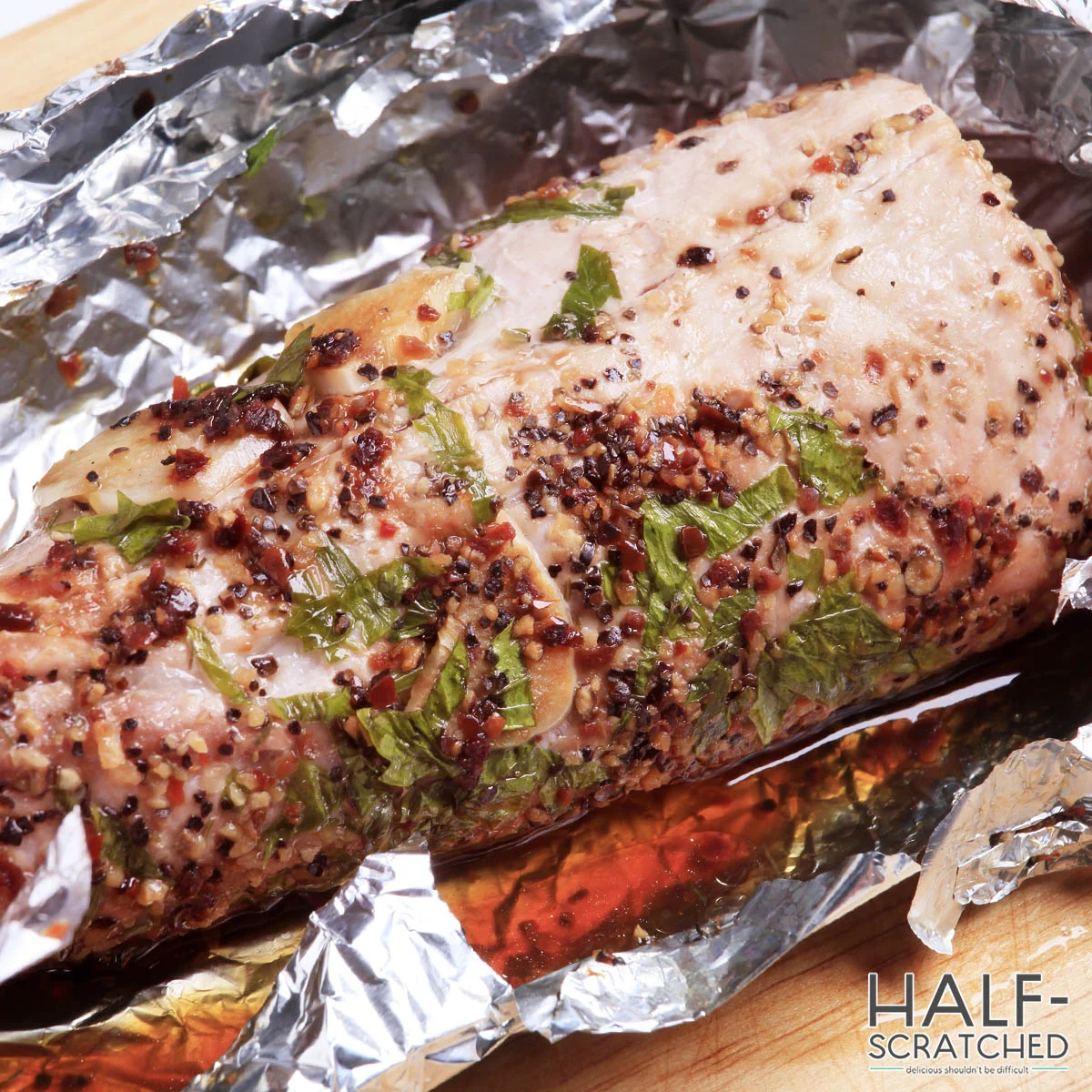 Seasoned pork tenderloin in foil