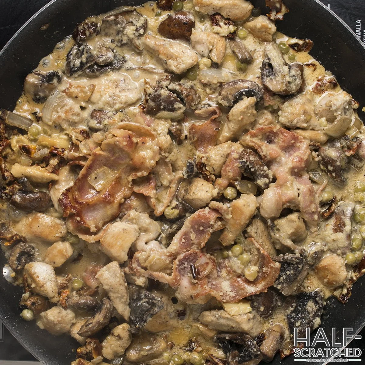 Parmesan cheese with pieces of chicken and mushrooms