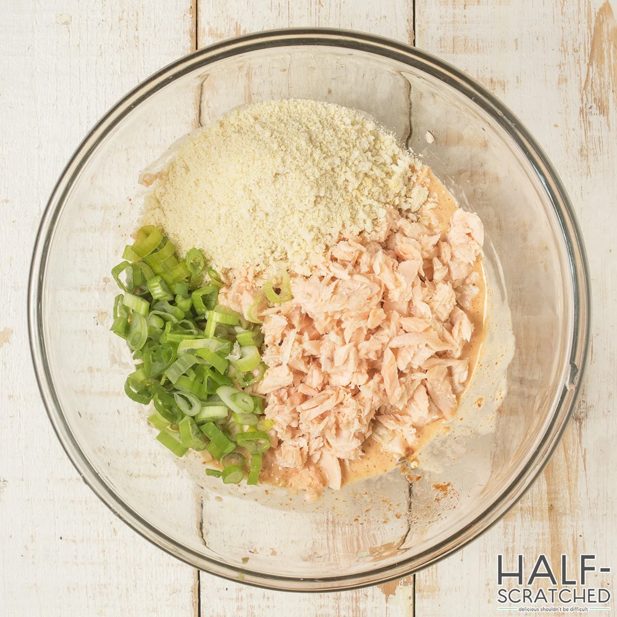 Ingredients to make the recipe for salmon patties in a bowl