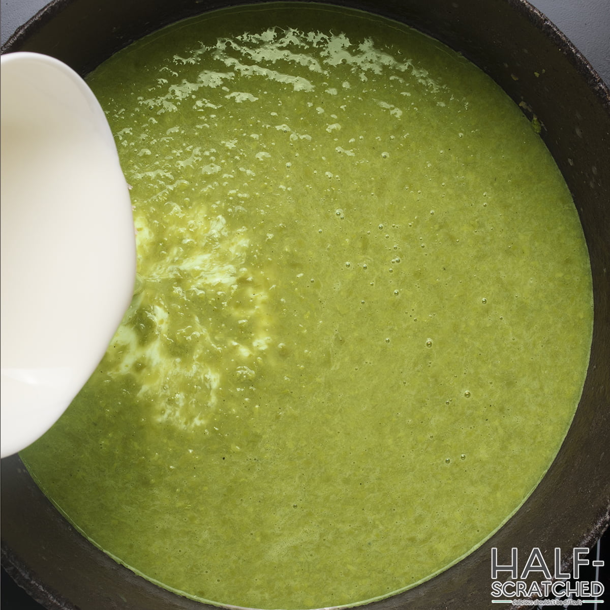 Adding the heavy cream to asparagus soup
