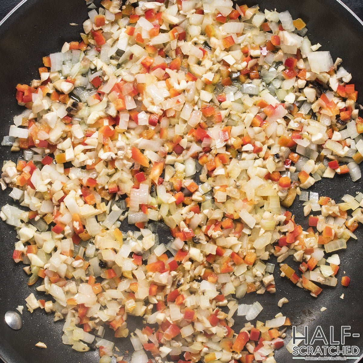 Frying mushrooms, onion and peppers