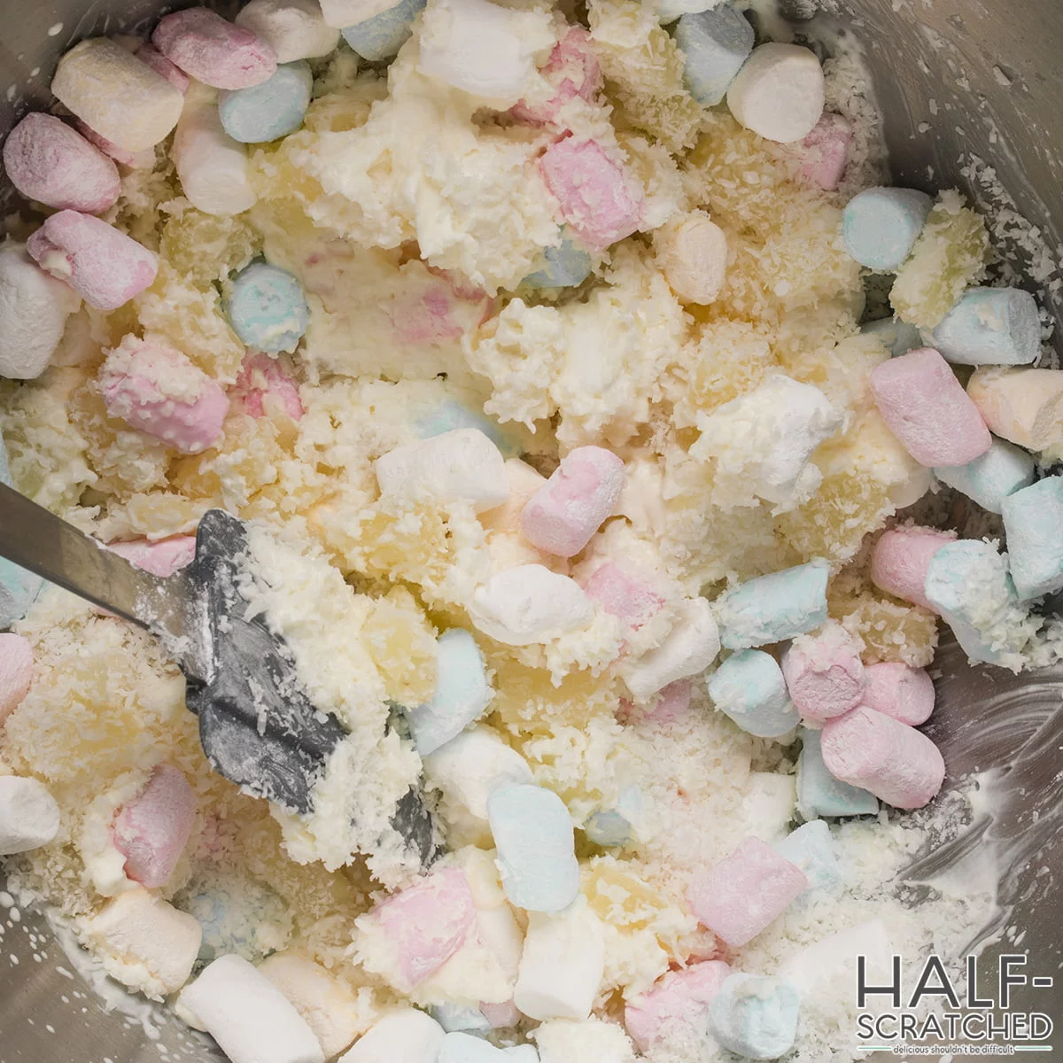 Marshmallows with pineapple, and coconut in a bowl