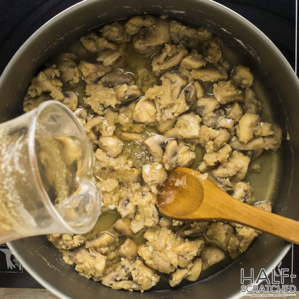 Adding broth into the roux