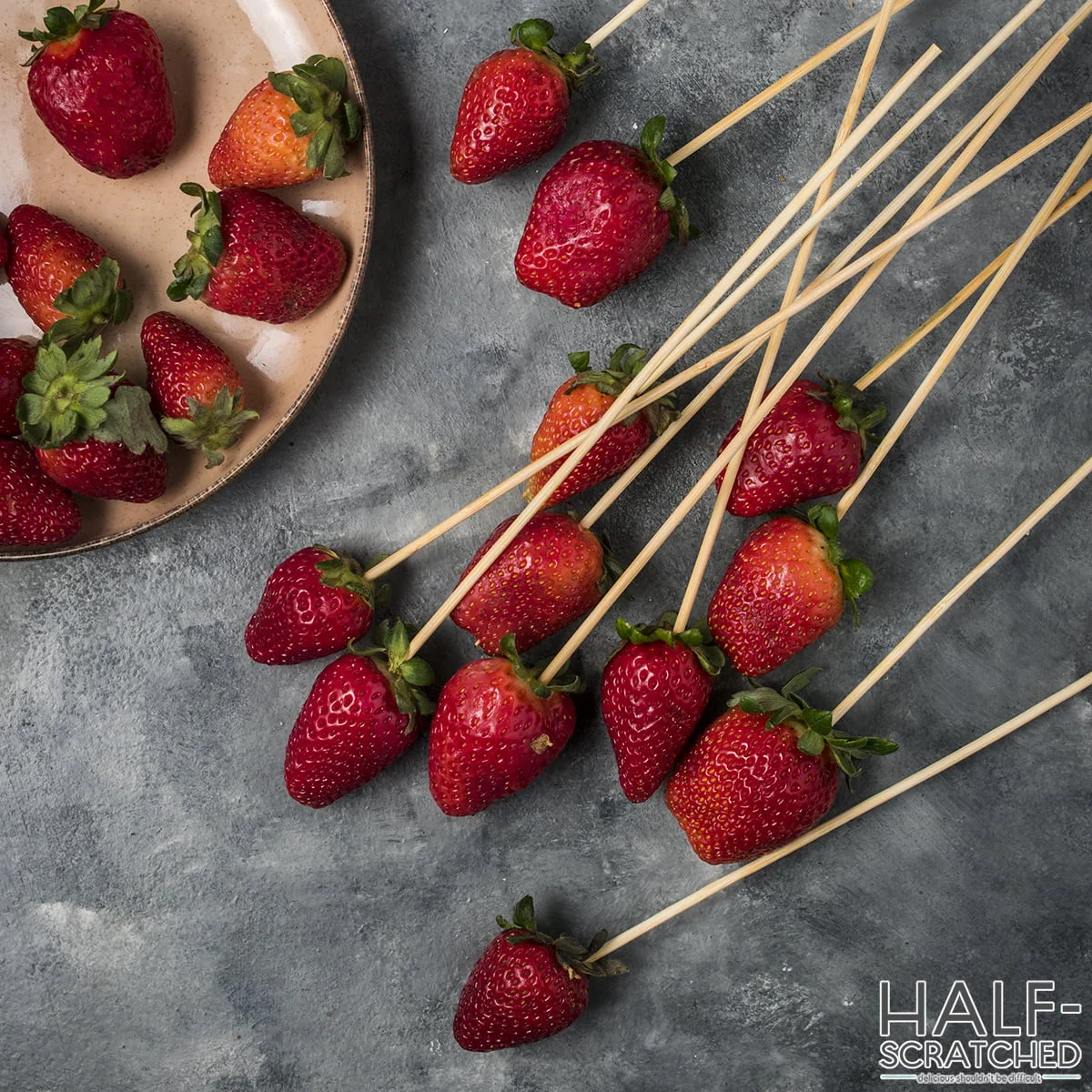 Toothpicks into strawberries