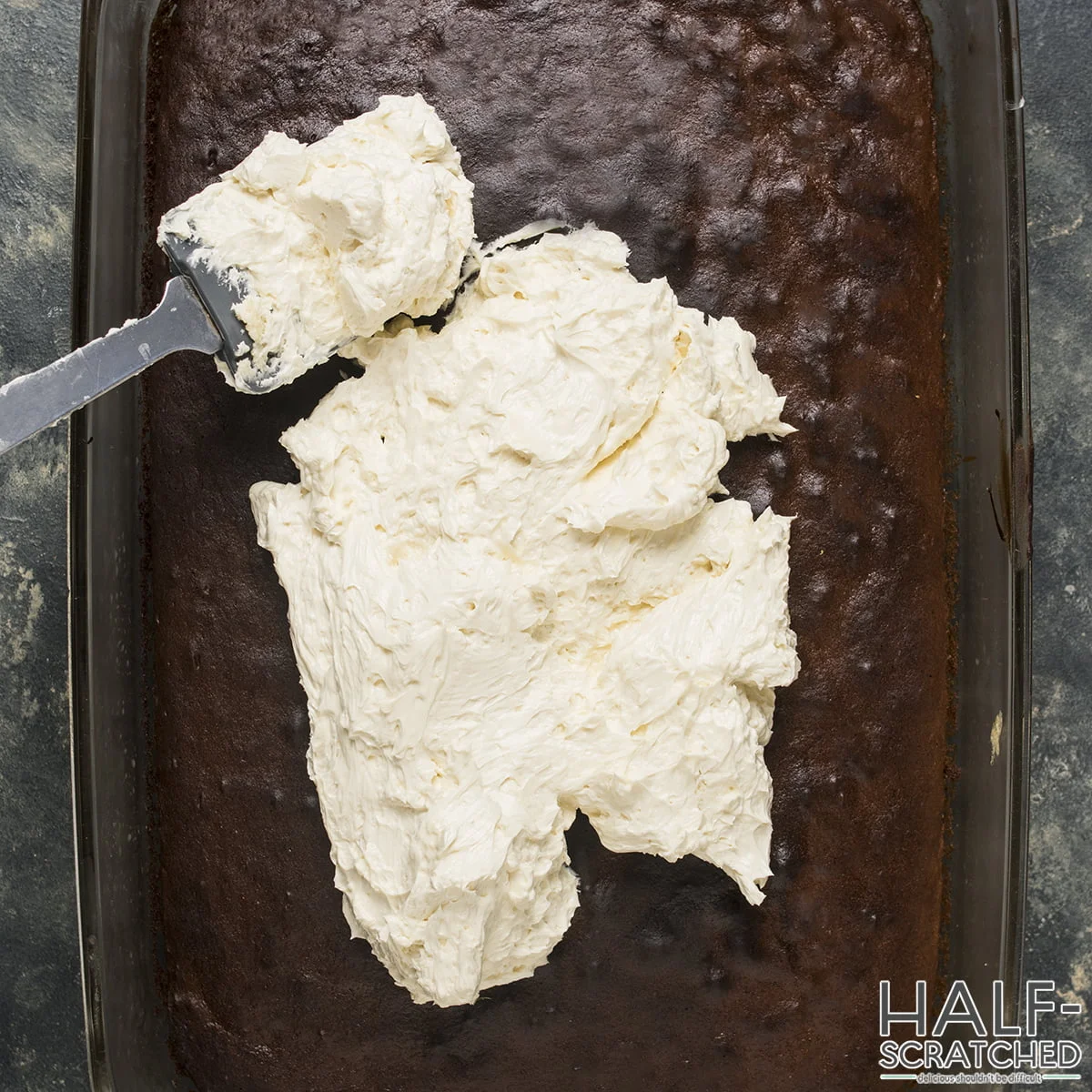 Spreading the mixture over the cooled cake