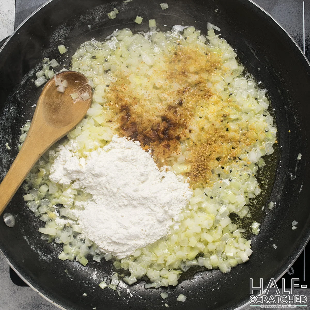 Flour, dry mustard, and cayenne mixed with frying onions