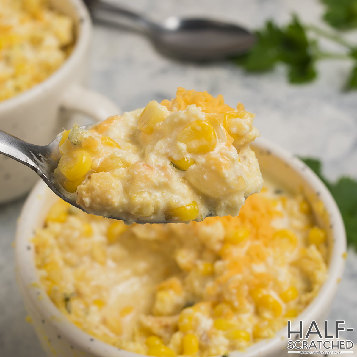 A spoon with corn pudding