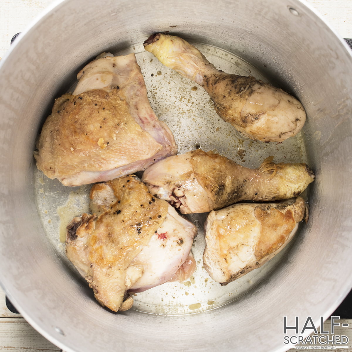 Chicken browning in a large pot