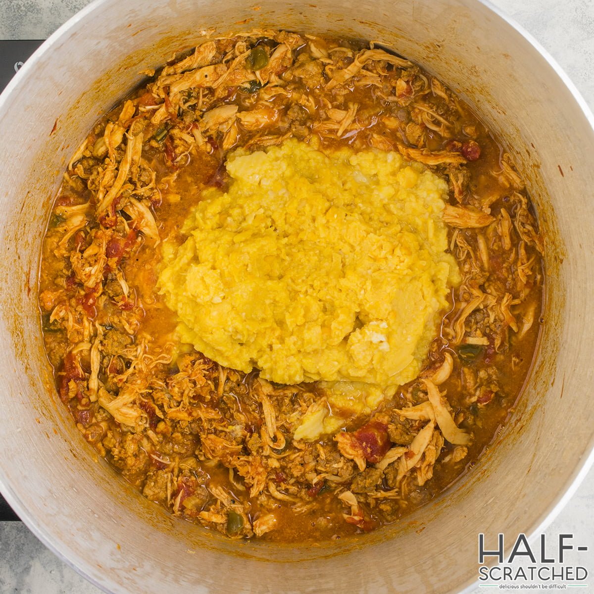 Close-up of Brunswick Stew with corn cream topping in pot