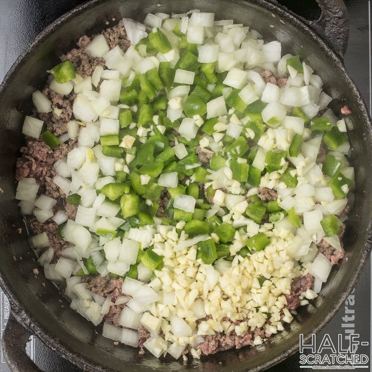 Onions, Peppers, and Garlic in Skillet with Beef