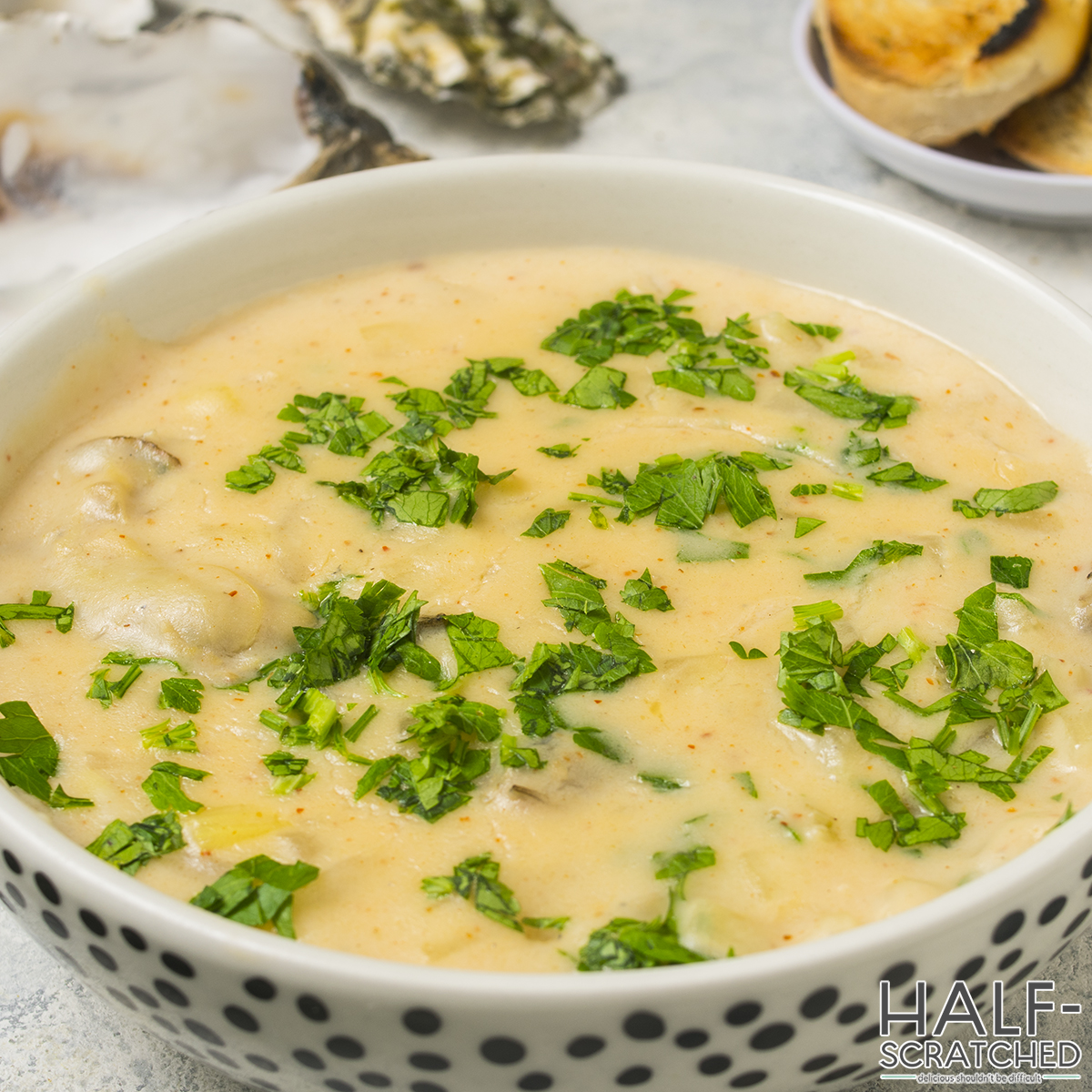 Close-up of a bowl of oyster stew with parsley
