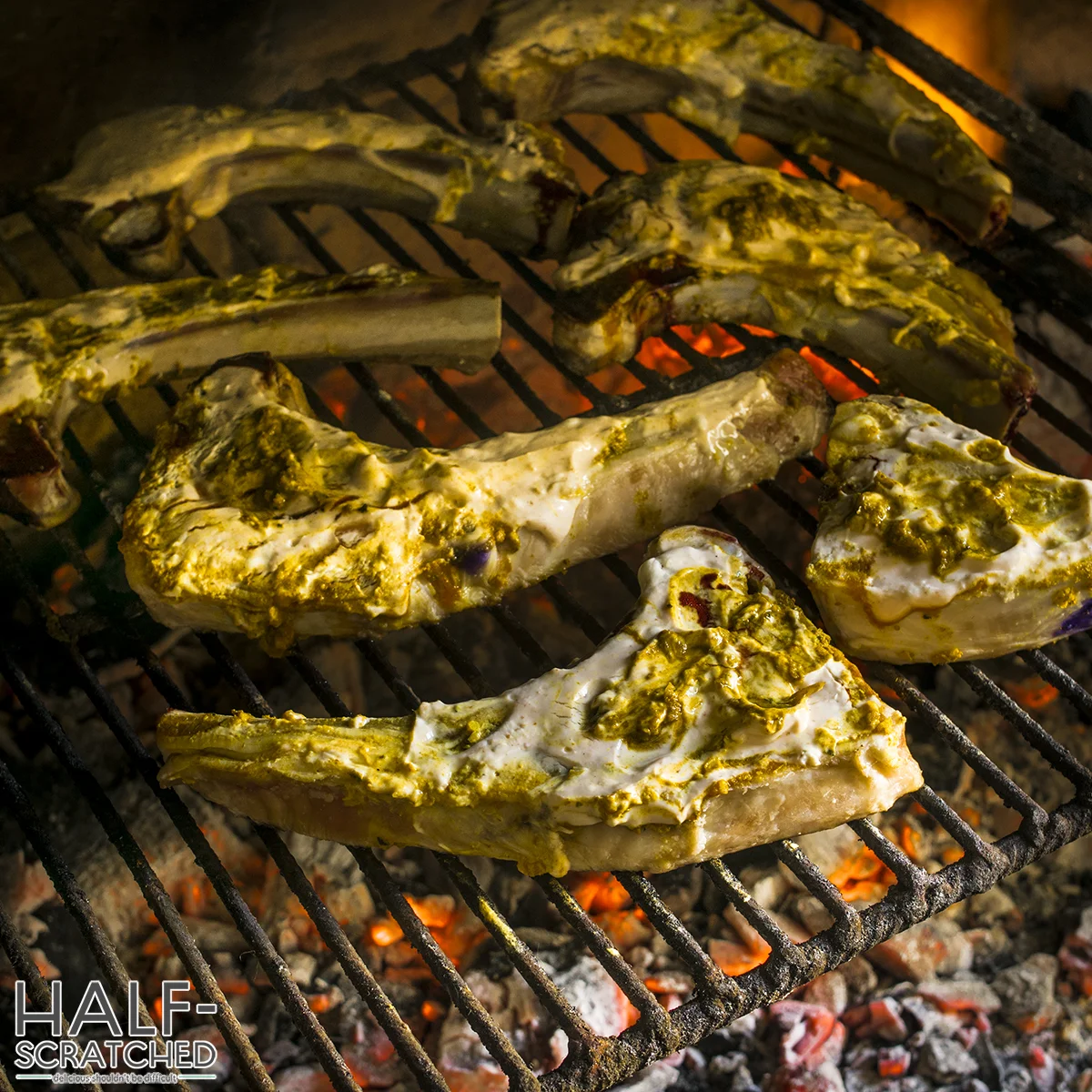 Lamb chops marinated and cooking on a grill