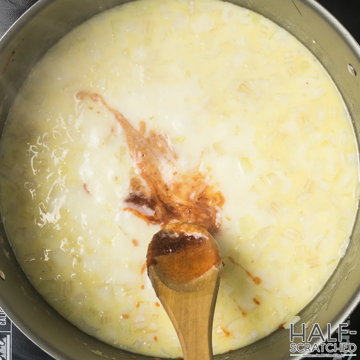 Adding hot sauce to oyster stew