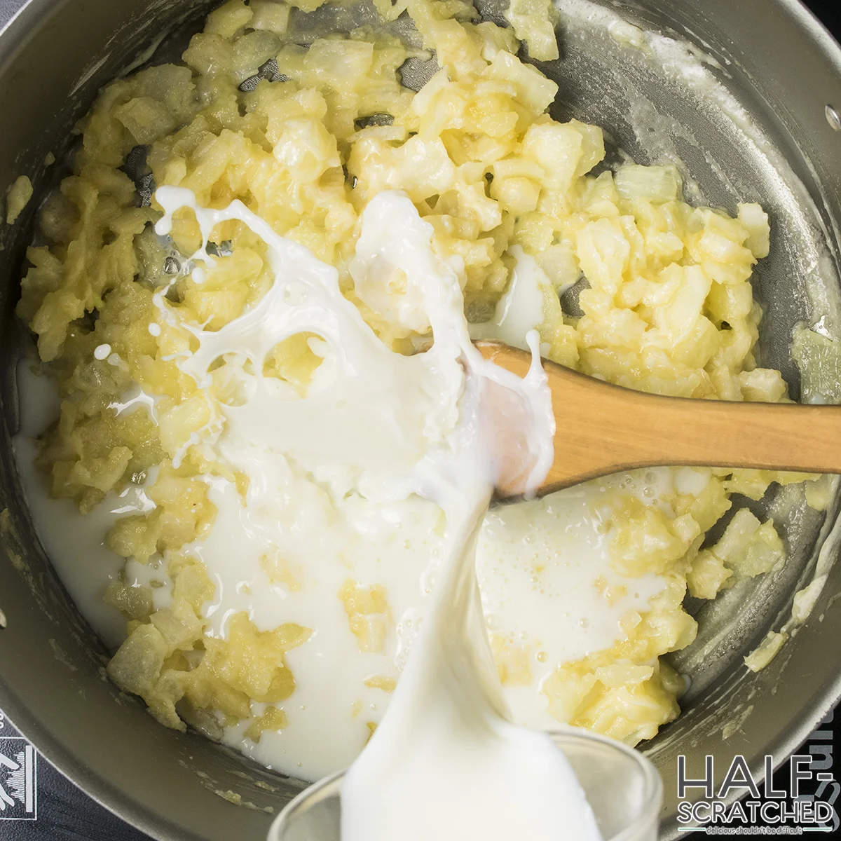 Pouring milk and cream into the stew