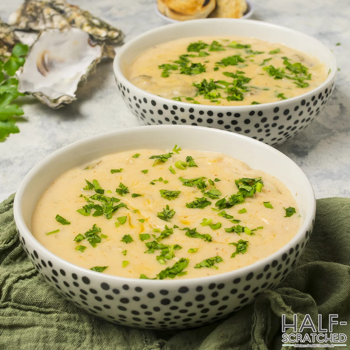 Close-up of a bowl of oyster stew with parsley